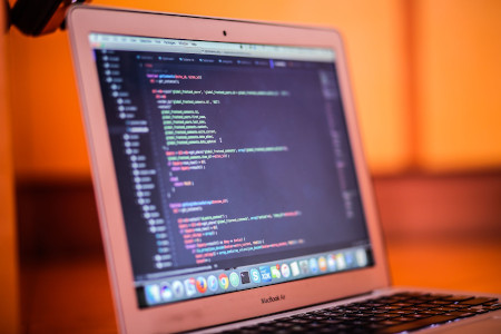 Modern WordPress website displayed on a laptop with cloud hosting technology